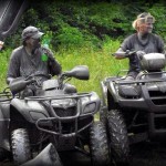 ATV riders covered in mud near Oceana