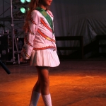 A young dancer in brilliant costume