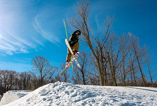 A skier at Canaan Valley Resort is captured in mid-jump.