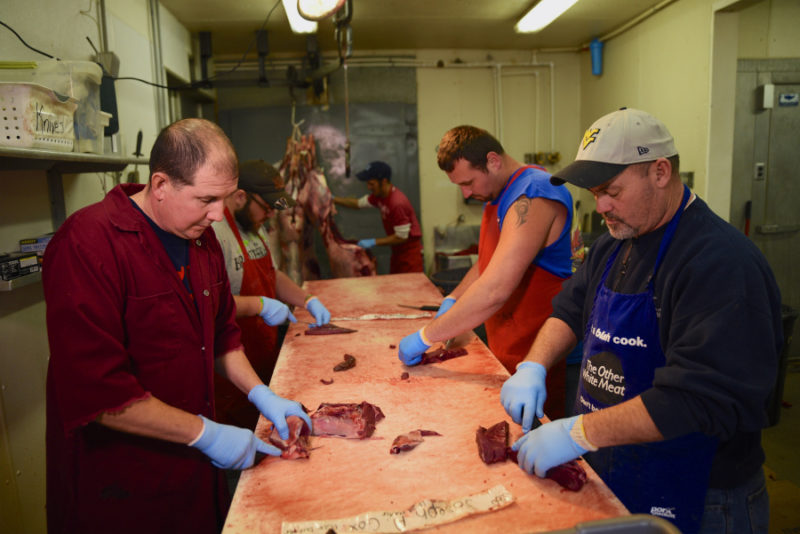 Volunteers prepare deer meat to be distributed to West Virginians in need through the Hunters Helping the Hungry program. Photo courtesy W.Va. DNR.