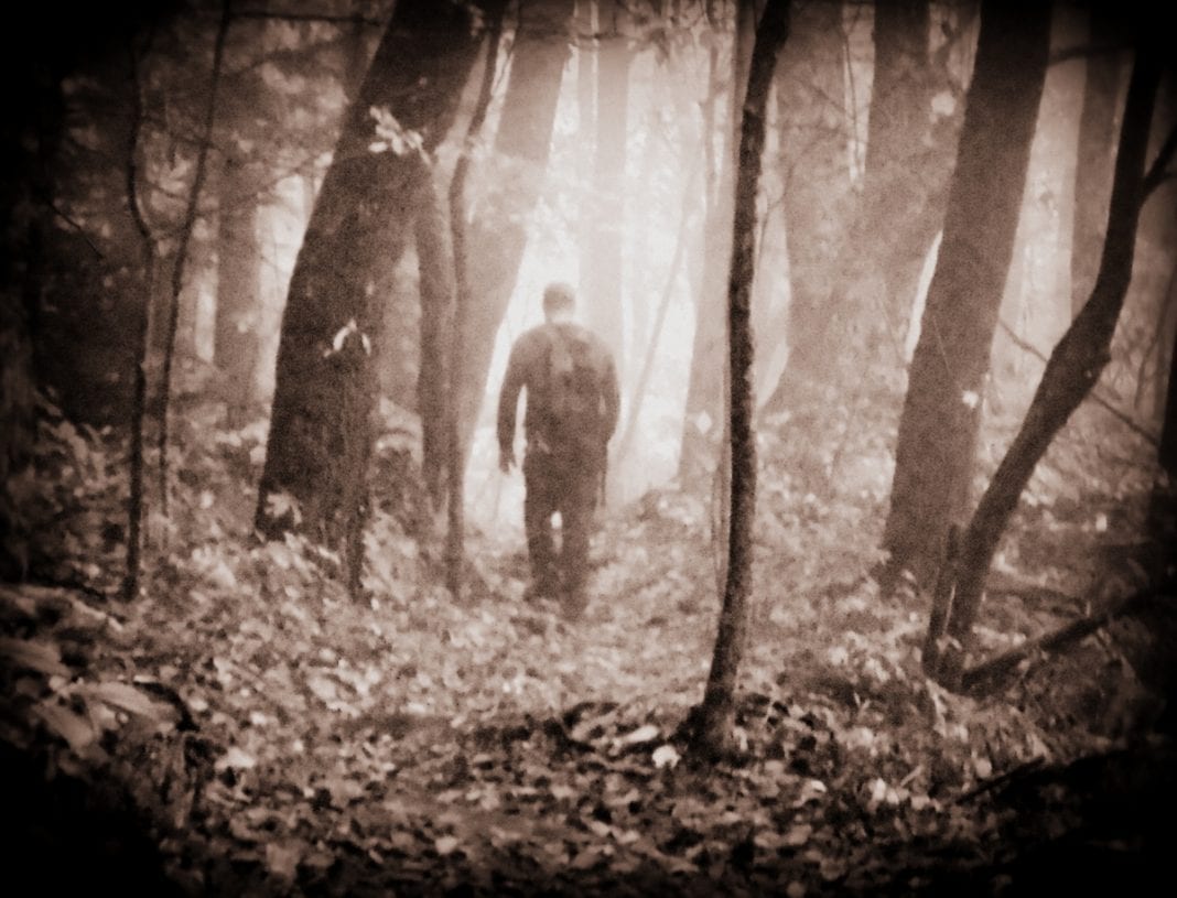 Trail-builder Gary Morefield walks through a mist on the Ship Rock Trail in the Grey Flats Trail System at Beckley, West Virginia.