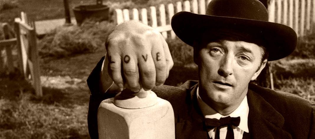 Robert Mitchem displays LOVE-HATE tattoos in 