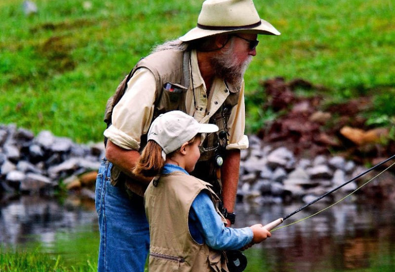 A father and daughter enjoy family fishing trip in West Virginia. Photo courtesy W.Va. Dept. of Commerce.