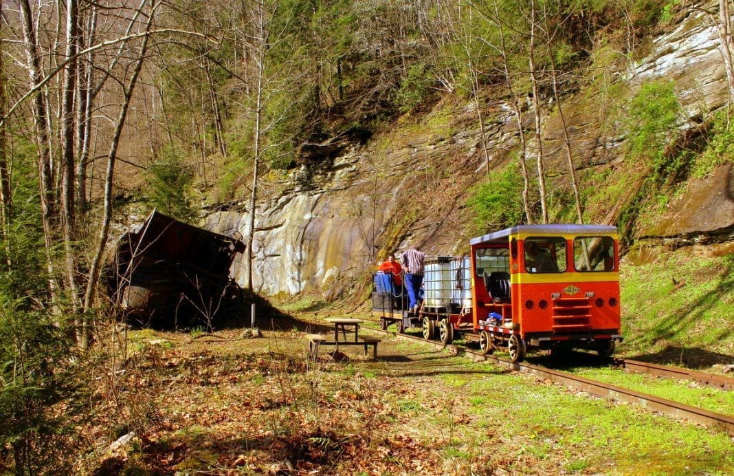 Passengers pass a wreck along the old Buffalo Creek & Gauley Railroad.
