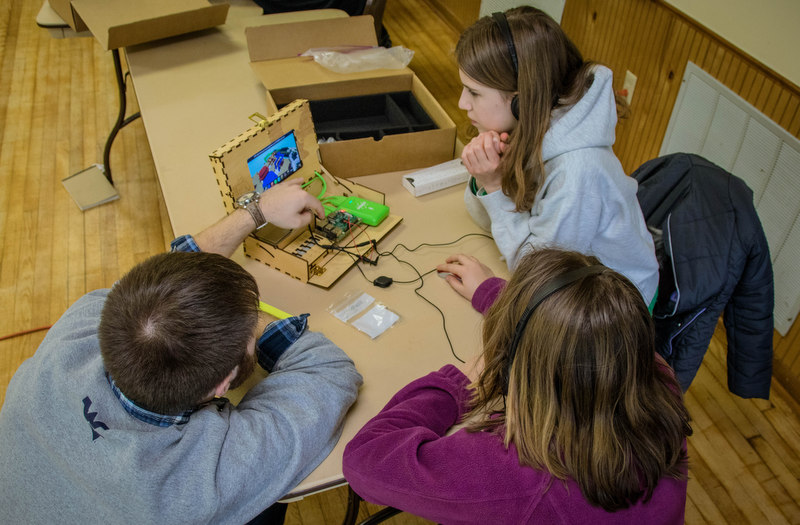 Students learn programming in the classroom through WVU extension programs.