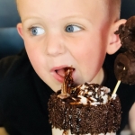 A youth tries an I Scream Sundae