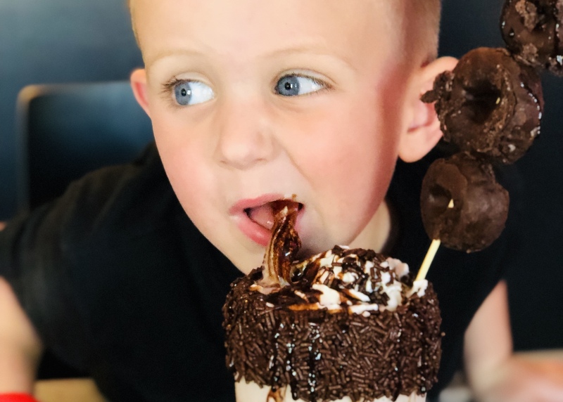 A youth tries an I Scream Sundae at Ripley, West Virginia.