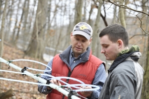 Jamie Schuler (left), associate professor of silviculture, teaches a WVU student about maple syrup production.