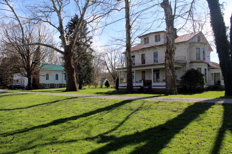 Historic homes line Front Street on the Ohio River in Hartford City, West Virginia.