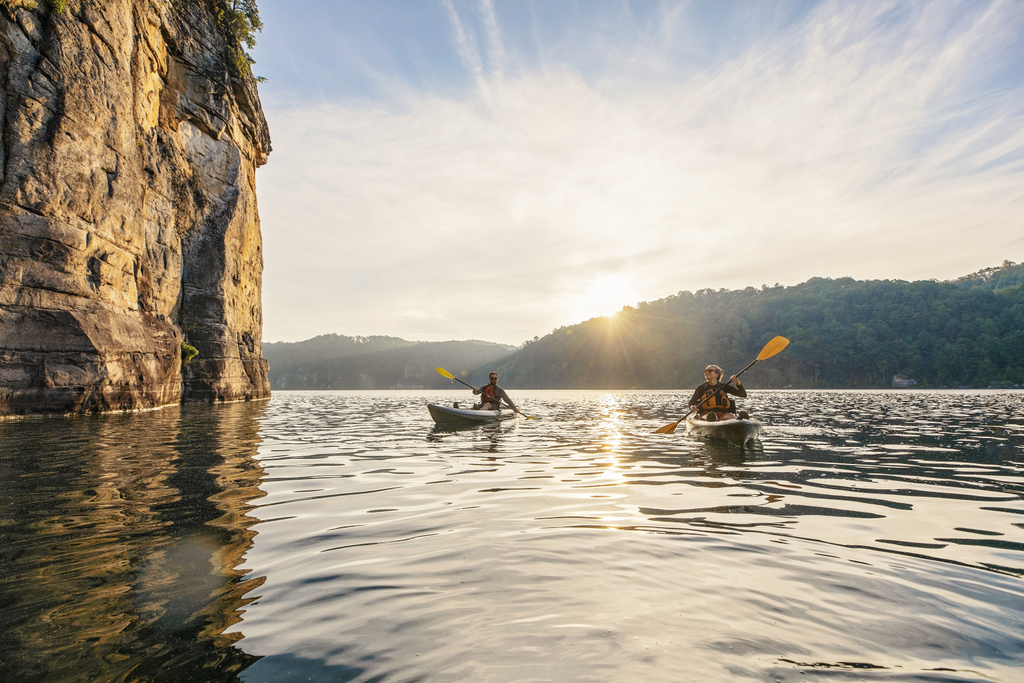 Kayakers explore the cliffs along Summersville Lake near the New River Gorge. 