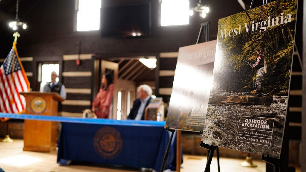 West Virginia officials unveiled collectible travel guides at the lodge at Hawks Nest State Park.