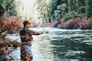 An angler casts into a trout stream. Trout fishing is perennially popular across West Virginia.