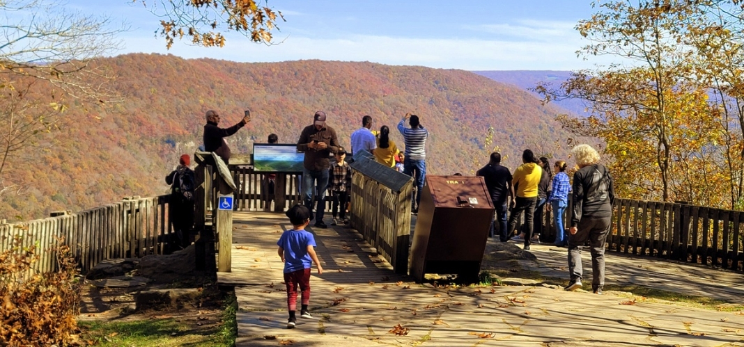 Sightseers gather at the New River Gorge overlook at Grandview.