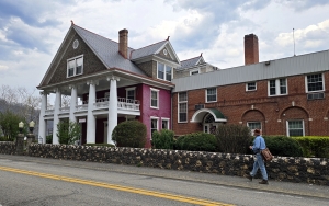 The Glen Ferris Inn on US-60 stands across the river from VanBibber's Rock.