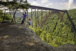 Climbers explore the New River Gorge National Park, a 30-minute drive from downtown Charleston.