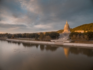 Sunlight glimmers on the gilded dome of the West Virginia statehouse.