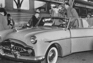 Queen Juliana and Prince Bernhard of the Netherlands are helped out of an auto by Michigan Governor G. Mennen Williams. They were transferring to special C&O Railway train where they were hosted to dinner by C&O President Walter Tuohy in his business car, Chessie 29. Queen Juliana was on a U.S. tour and had just visited Holland, Michigan.