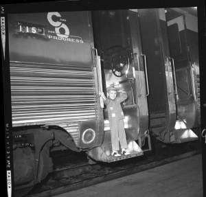 Prince Albert II, heir to the princely throne of Monaco, son of Prince Rainier III and Princess Grace (formerly actress Grace Kelly) poses in C&O outfit on a passenger car during his family’s trip aboard Chessie 29. Gifted to him by C&O Railway President Walter J. Tuohy, Prince Albert was reportedly so pleased with the engineer’s costume that he put on the outfit immediately and did not want to take it off. Prince Albert II is the current sovereign prince of Monaco. Prince Rainier III, Grace, Albert, and Caroline visited The Greenbrier in April 1963, traveling on Tuohy's business car Chessie 29.
